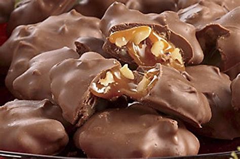 Pecan and caramel wrapped in milk chocolate clusters by mascot